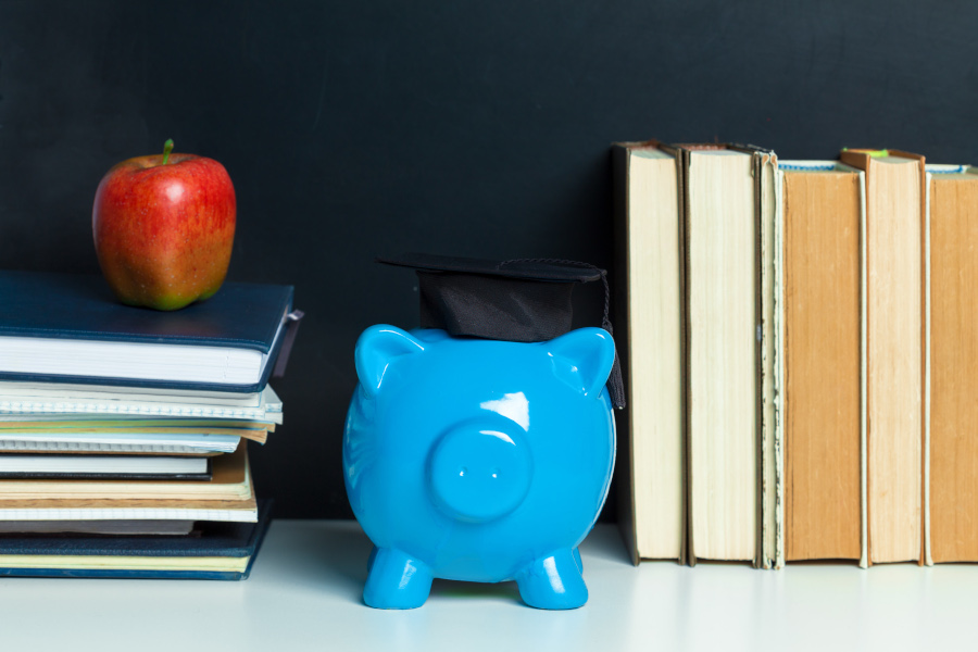 College graduate student diploma piggy bank